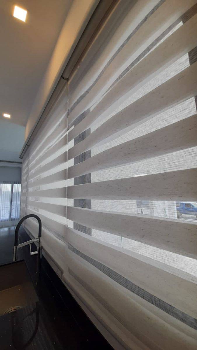 Duplex blinds showing day and night modes in Dubai bedroom