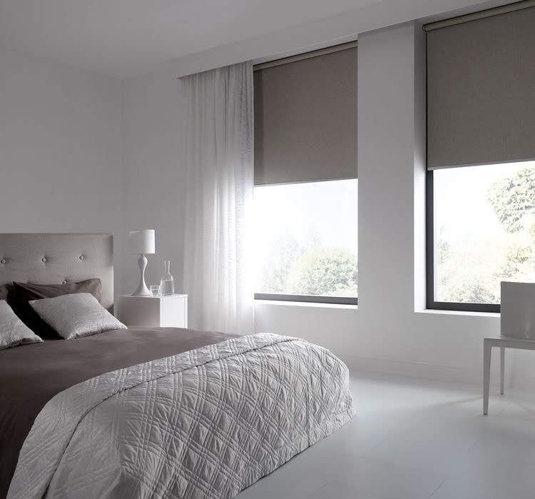 Elegant Roman blinds in Dubai bedroom setting